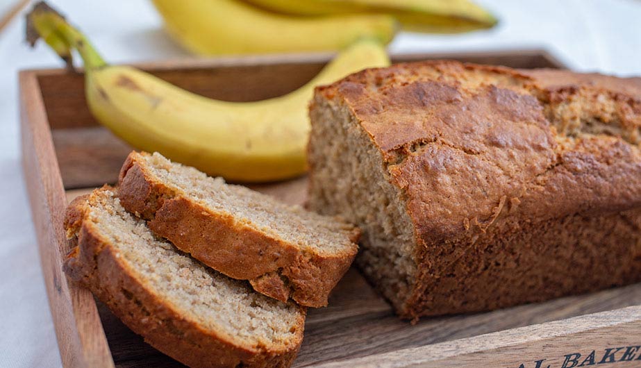 Moist Banana Bread Slices Moist banana bread slices arranged neatly to showcase soft interior texture
